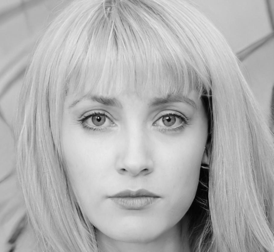 Elena Morales, Senior Blockchain Consultant, explaining different blockchain implementation strategies during a client consultation